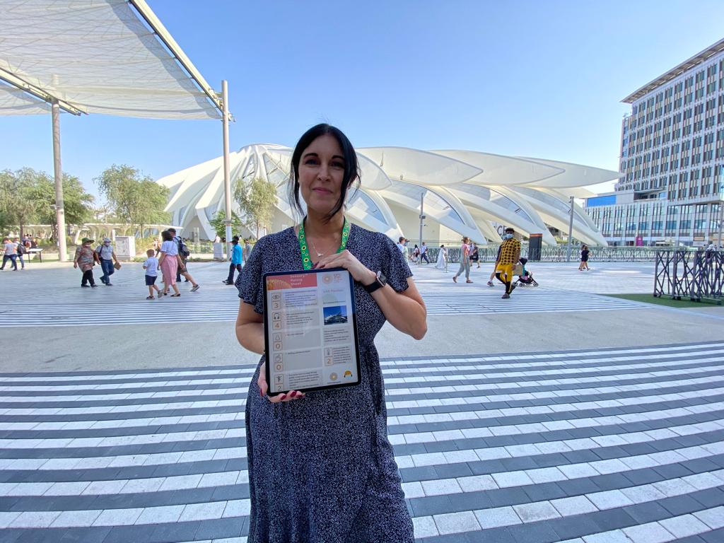 Dr Ferdico holding a digital Sensory Rating Card at Expo 2020 Dubai